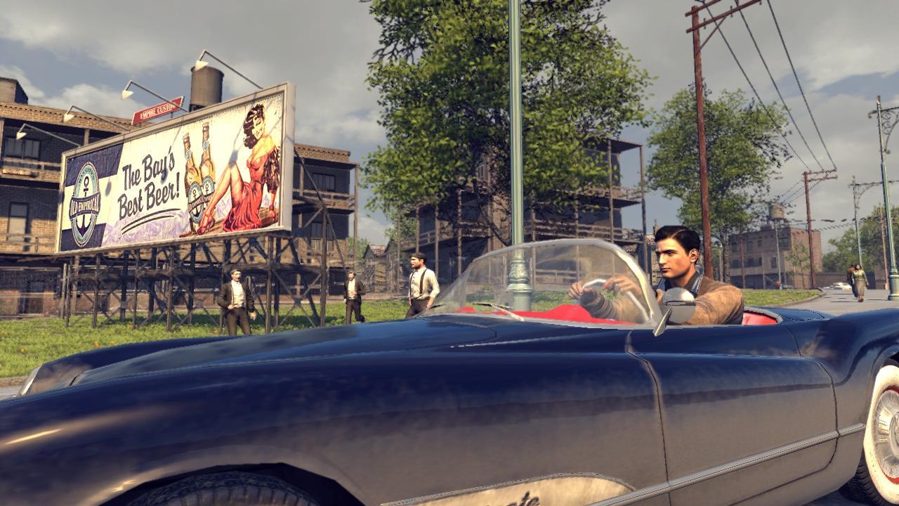 A player cruising through Empire Bay in a period convertible